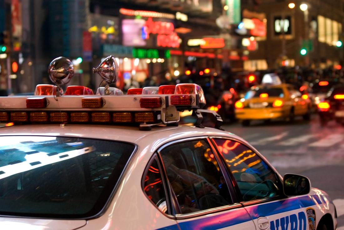 An NYPD police cruiser parked on a Manhattan street
