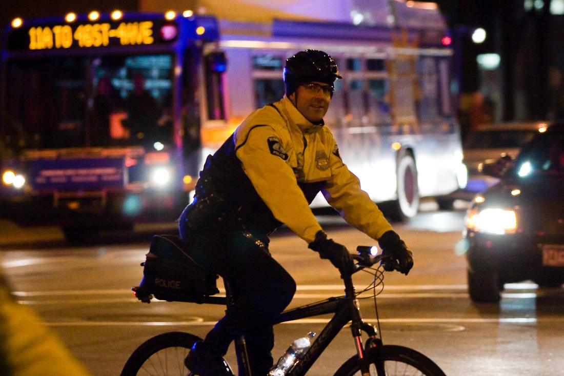 Police bicycle patrol officers at night
