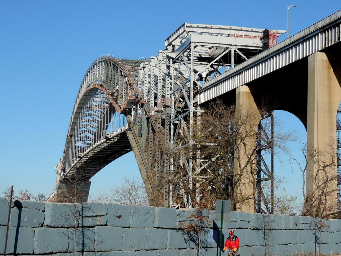 Scaffolding wrapping a bridge approach under renovation