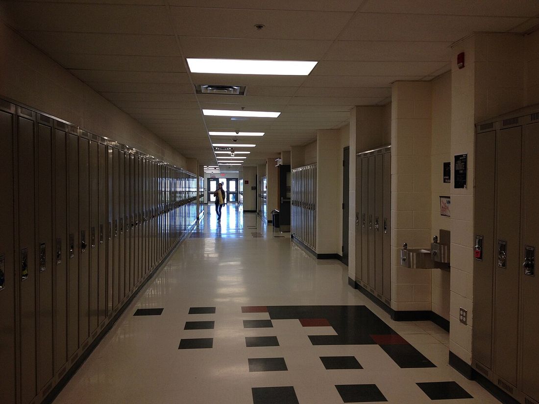 A school corridor lined with lockers