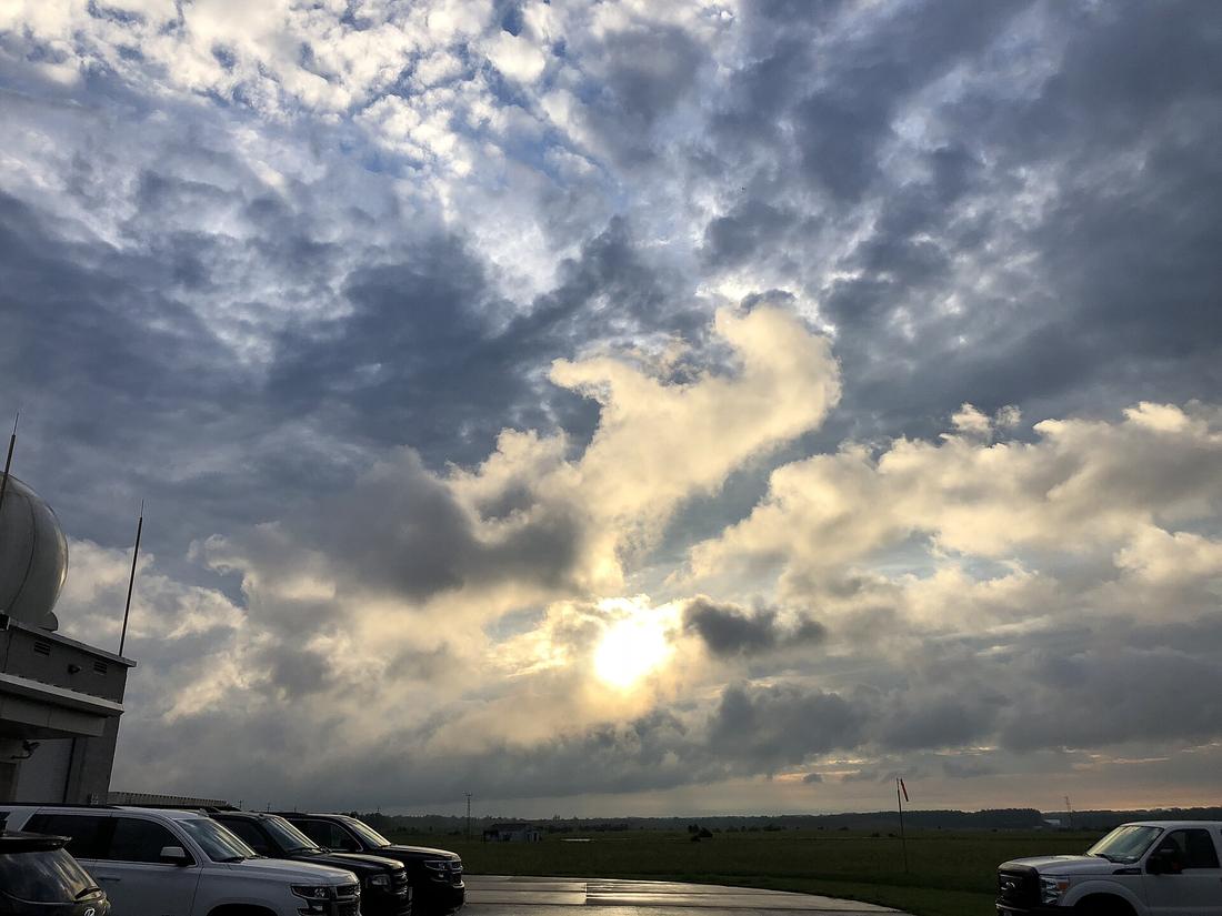 Morning sun breaking through cumulus clouds